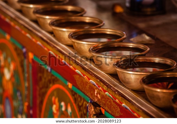 Offerings (Tibetan Water\
Offering Bowls) in Likir gompa (Tibetan Buddhist monastery).\
Ladakh, India