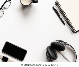 
					Office accesories. Top view of some office accesories with empty middle isolated on white background. Flat lay. Copy space for the text.