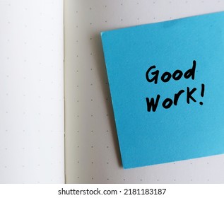 Office Blue Note On Notebook With Handwriting Good Work , Compliment Team Or Workers For The Good Work, Giving Praise To Someone For A Job Well Done