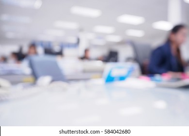 Office Blurred Background With People Working At Desk