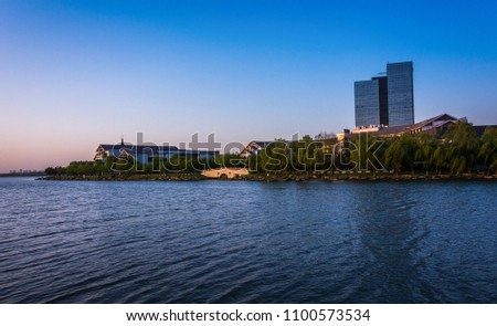 office building near the lake in sunset