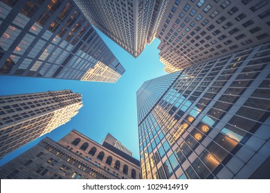 Office building top view background in retro style colors. Manhattan buildings of New York City center - Wall street - Shutterstock ID 1029414919