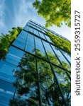 office building with tree for reducing carbon dioxide, Eco green environment , Modern Eco-Friendly Building with Vertical Gardens, Contemporary building featuring vertical gardens on balconies, blendi