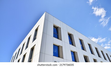 Office building with white aluminum composite panels. Facade wall made of glass and metal. Abstract modern business architecture.