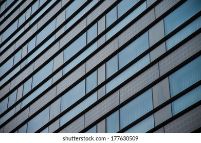 Office building windows with blue sky reflection