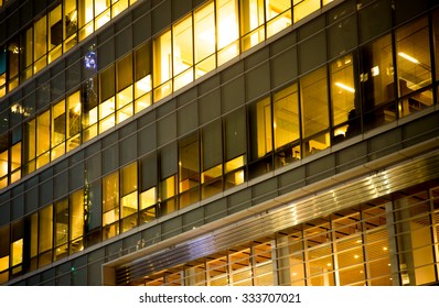 Office Building Windows Lit Up At Night