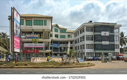 Office Buildings In Accra. People Walk Along The Road. Urban Infrastructure In Africa. Ghana, Accra – January 19, 2017