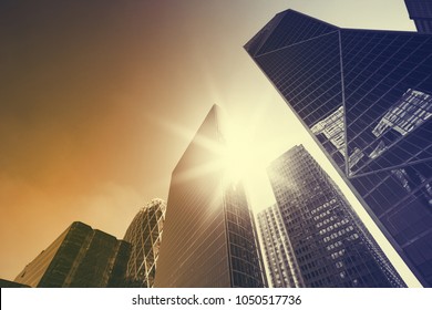 Office buildings in Paris business district La Defense. Sskyscrapers glass facades and sunbeam in the sky. Modern urban architecture, economy, finances, business activity concept illustration