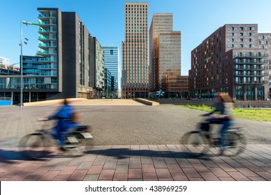 Office buildings with people bicycling at Amsterdam Zuid, Amsterdam, Netherlands.
