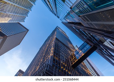 Office buildings stretch up to the blue sky in the financial district in downtown Toronto Ontario Canada. - Shutterstock ID 251068444
