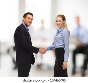 Office, Buisness, Teamwork Concept - Man And Woman Shaking Their Hands