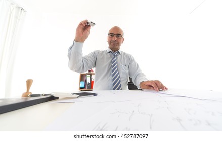 Office Bureaucrat Applying Stamps On Papers