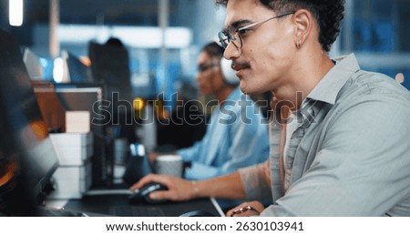 Office, businessman and reading with computer for coding, web development and scroll on website. Coworking, night and male programmer with technology for programming, software update and information