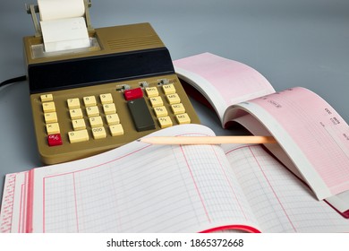 Office Calculator, Ledger And Check Book