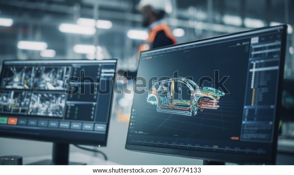Office at Car\
Assembly Plant. Close Up Shot of a Modern Computer Computer Monitor\
with Factory Line Management System, Overviewing Autonomous Car\
Production, Showing Car\
Structure.