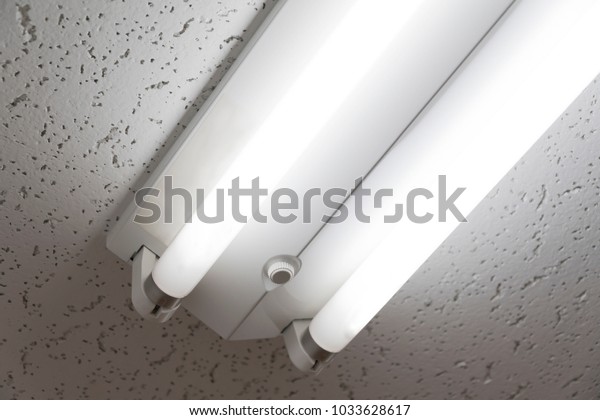 Office Ceiling Fluorescent Light 3 Wavelength Stock Photo