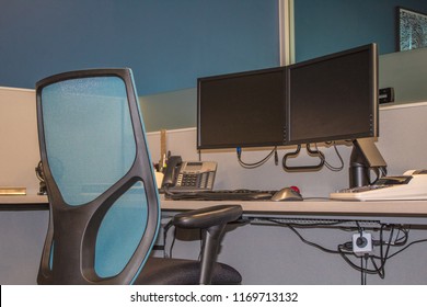 Office Chair And Double Monitors On Desk