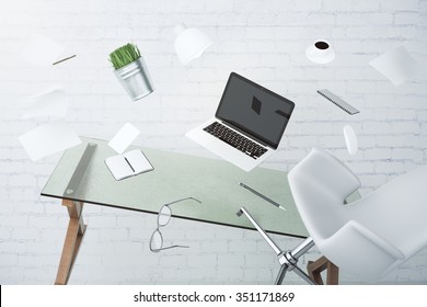 Office chaos concept with laptop, furniture and other accessories flying in the air 3D Render - Shutterstock ID 351171869