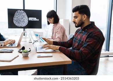 Office colleagues collaborating on artificial intelligence project. Team members analyzing data, discussing findings, using laptops. Modern office environment with natural light. - Powered by Shutterstock