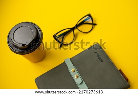 Similar – Business objects, cup of coffee, pen, phone and glasses.