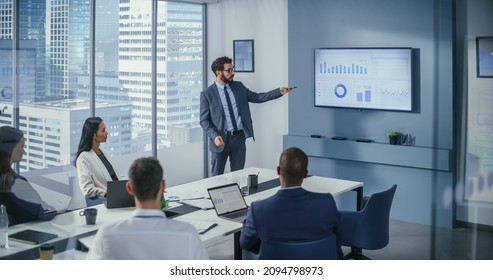 Office Conference Room Meeting: Digital Enterpreneur Presents e-Commerce Investment Strategy for Group of Investors. Wall TV Showing Big Data Analysis, Infographics, Stock Market Information, Trends - Shutterstock ID 2094798973