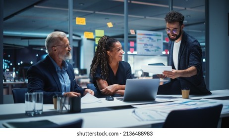 Office Conference Room Meeting: Diverse Team of Top Managers Talk, Brainstorm, Use Laptop Computer. Business Partners Discuss Financial Reports, Plan Investment Strategy and Managerial Operations. - Powered by Shutterstock