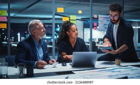 Office Conference Room Meeting: Diverse Team of Top Managers Talk, Brainstorm, Use Laptop Computer. Business Partners Discuss Financial Reports, Plan Investment Strategy and Managerial Operations. - Powered by Shutterstock