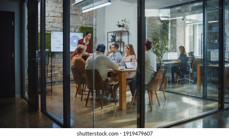 Office Conference Room Meeting: Female Chief Executive Talking To A Diverse Team Of Professional Businesspeople. Creative People Listen To CEO Discuss Design, Data Analysis, Plan Marketing Strategy