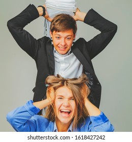 Office Conflict Between Man And Woman At Work. The Male Business Bos Beats His Female Worker. Selective Focus.