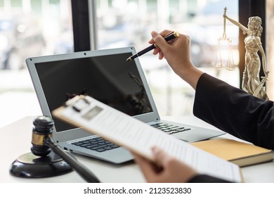 Office for Consulting Attorney Ideas Female lawyer at work with laptop, hammer and papers with tape scales Daughters of Justice