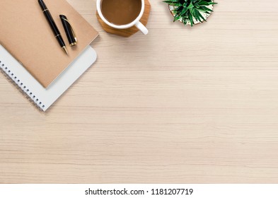 Office Desk Flat Lay With Hot Coffee, Notebook And Plant On Top View And Copy Space. Business Desk Minimal Style Concept. Blog, Blogging Or Work From Home. 