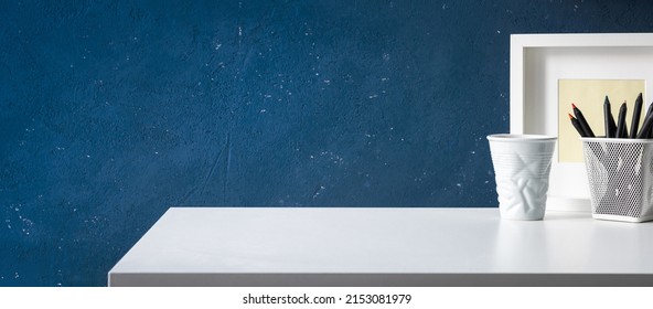 Office Desk At Home With Blue Wall And Simple Supplies. White Table Mock Up.	
