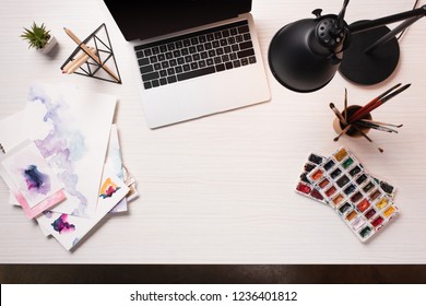 Office Desk With Laptop With Blank Screen, Copy Space And Art Supplies, Flat Lay