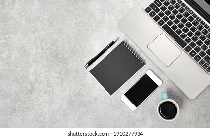 Office Desk With Laptop, Smartphone, Cup Of Coffee. Top View Work Place With Copy Space.Distance Office.