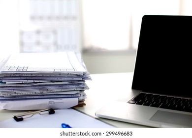 office desk a stack of computer paper reports work forms