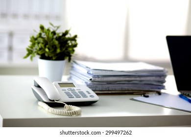 office desk a stack of computer paper reports work forms