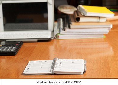 Office desk table with computer, calculator, supplies. Copy space for text.