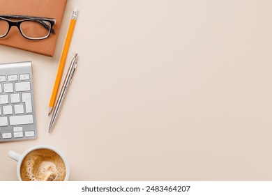 Office desk table with computer, cup of coffee and supplies. Top view with copy space. Flat lay