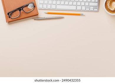 Office desk table with computer, cup of coffee and supplies. Top view with copy space. Flat lay