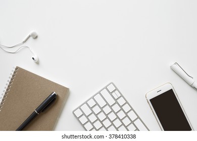 Office desk table with computer keyboard, office supplies on white background