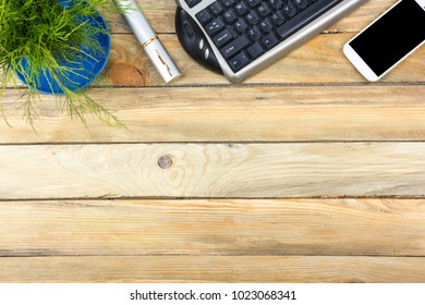 Office desk table with computer, pen and a cup of coffee, lot of things. Top view with copy space