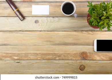Office desk table with computer, pen and a cup of coffee, lot of things. Top view with copy space