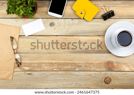 Office desk table with computer, pen and a cup of coffee, lot of things. Top view with copy space