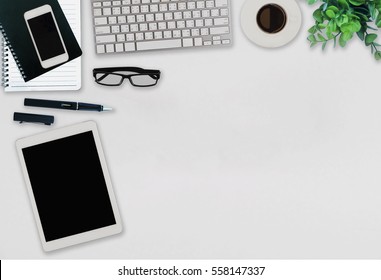 Office Desk Table With Computer, Supplies,analysis Chart, Ipad,smartphone,coffee Cup On Wooden Background. Top View With Copy Space