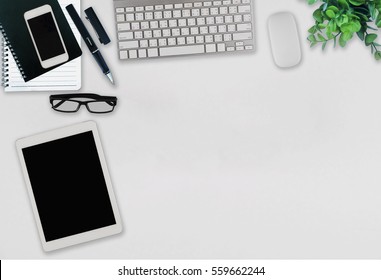 Office Desk Table With Computer, Supplies,analysis Chart, Ipad,smartphone,coffee Cup On Wooden Background. Top View With Copy Space