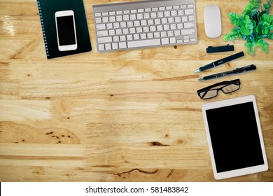 Office Desk Table With Computer, Supplies,analysis Chart, Ipad,smartphone,coffee Cup On Wooden Background. Top View With Copy Space