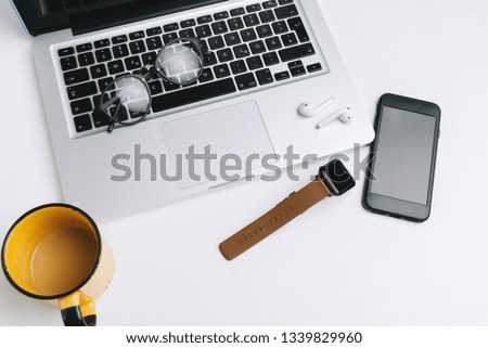 Office desk table with laptop and objects. View from top with copy space. Flat lay concept 