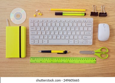 Office desk template with keyboard and office items. View from above