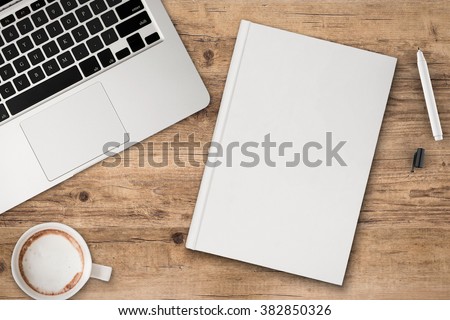 office desk top view with blank notebook