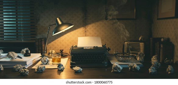 Office desk with vintage typewriter and crumpled paper balls, creative block concept, 1950s film noir style - Powered by Shutterstock